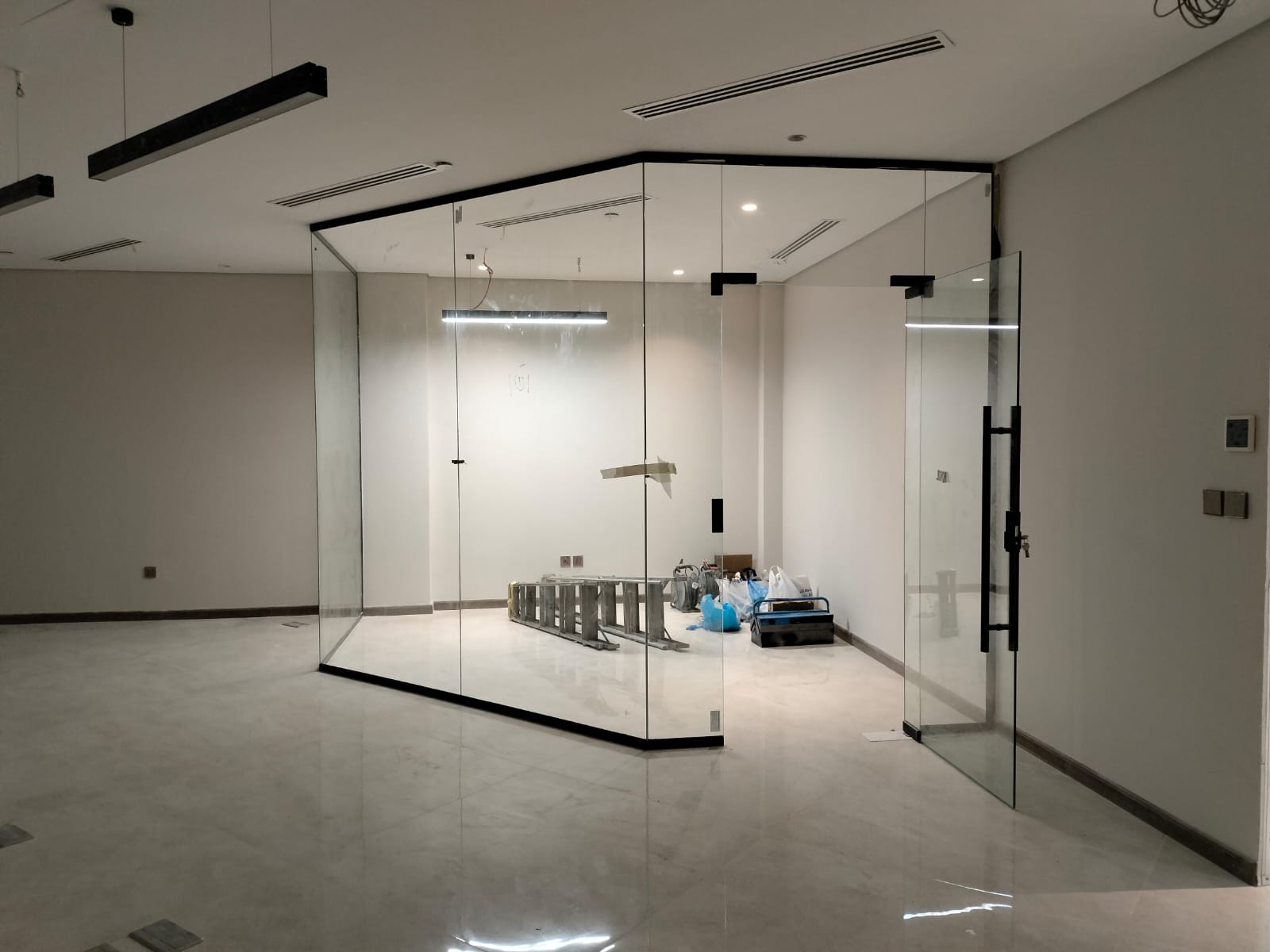 Frameless glass office partition with city view